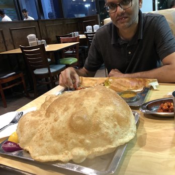Saravanaa Bhavan - Saravana Bhavan - channa batura - with my friend watching in awe - Indian Near Me - Sugar Land, Texas Saravanaa Bhavan - Saravana Bhavan - channa batura - with my friend watching in awe - Indian Near Me - Sugar Land, Texas