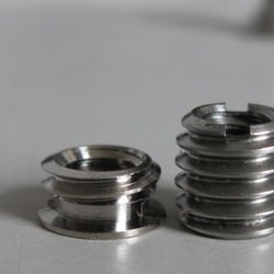 Really Right Stuff - 3/8"-1/4" reducer bushing. The RRS has more thread engagement available.