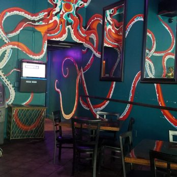 The Mermaid Dive Bar - Wall Art was very octopus-like. But the jelly fish lanterns and light fixtures were a cute touch - Dive Bars Near Me - Biloxi, Mississippi
