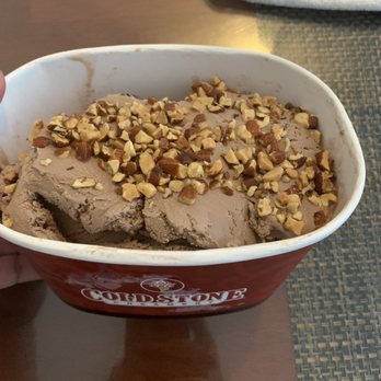 Cold Stone Creamery - Did not bother to mix the almonds with the chocolate. Just lazily sprinkled it. Lots of space unfilled. Feeling ripped off. - Chocolate ice cream with chopped nuts topping served in a Cold Stone Creamery bowl, placed on a table. - Custom Cakes Near Me - Patchogue, New York