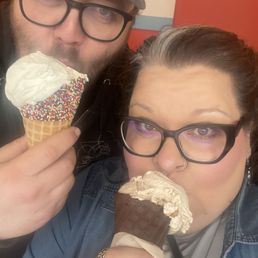 Vanilla ice cream in a sprinkle waffle cone and horchata ice cream in a chocolate waffle cone