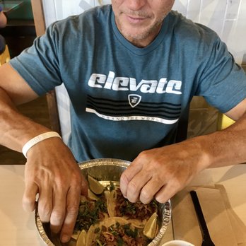 Costa Vida - a man sitting at a table with a plate of food - Mexican Near Me - Orem, Utah Costa Vida - a man sitting at a table with a plate of food - Mexican Near Me - Orem, Utah