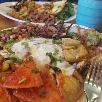 Tumerico - Vegetarian chilaquiles and huevos rancheros in the background - Vegan Near Me - Tucson, Arizona Tumerico - Vegetarian chilaquiles and huevos rancheros in the background - Vegan Near Me - Tucson, Arizona