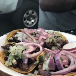 a person holding a plate of food a person holding a plate of food