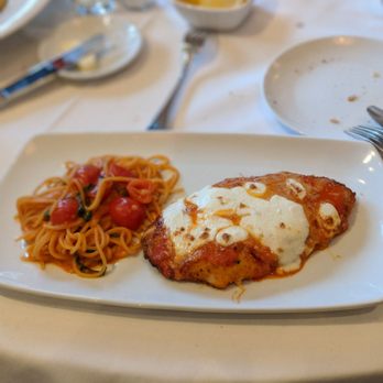 Via Roma - This is the bread crust chicken with spaghetti on the side. Amazing dish highly recommended - Italian Near Me - Charlotte, North Carolina Via Roma - This is the bread crust chicken with spaghetti on the side. Amazing dish highly recommended - Italian Near Me - Charlotte, North Carolina