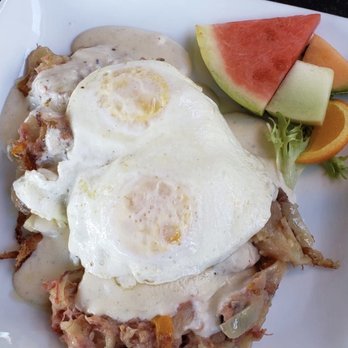 Sweet Breads - Corned beef over fresh made biscuit with gravy and two eggs. Also garnish with a variety of Fruits and salad - New American Near Me - Demorest, Georgia