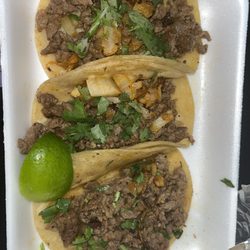 Las Amigos - Carne Asada Tacos with onions and cilantro.