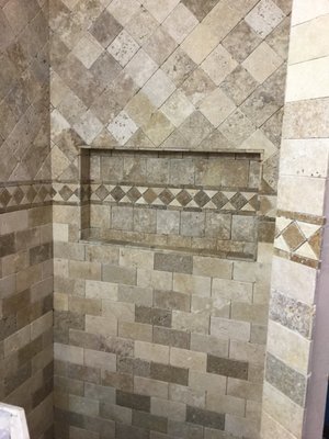 Bathroom remodel in San Diego - This bathroom was extremely old and outdated. We gutted it and built this gorgeous shower with exquisite design. The shower and floors were done with beautiful travertine for a high end feel. Bathroom remodel in San Diego - This bathroom was extremely old and outdated. We gutted it and built this gorgeous shower with exquisite design. The shower and floors were done with beautiful travertine for a high end feel.