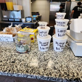 El Pollo Dorado - a counter with coffee cups and a blender - Mexican Near Me - Roswell, Georgia
