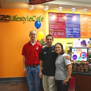 Nrgize Lifestyle Cafe - three people standing in front of a restaurant counter - Juice Bars & Smoothies Near Me - Irvine, California Nrgize Lifestyle Cafe - three people standing in front of a restaurant counter - Juice Bars & Smoothies Near Me - Irvine, California