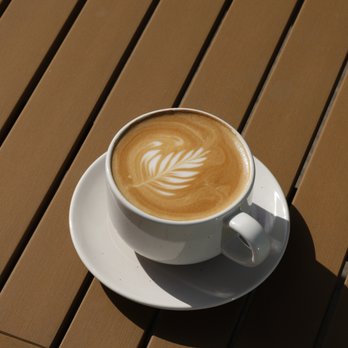 Pinpoint Cafe - a cup of cappuccino on a wooden table - Coffee & Tea Near Me - San Diego, California