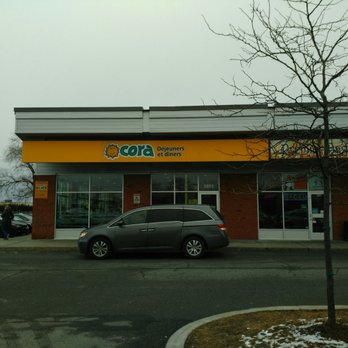 Cora - a car parked in front of a store - Breakfast & Brunch Near Me - Pierrefonds, Quebec