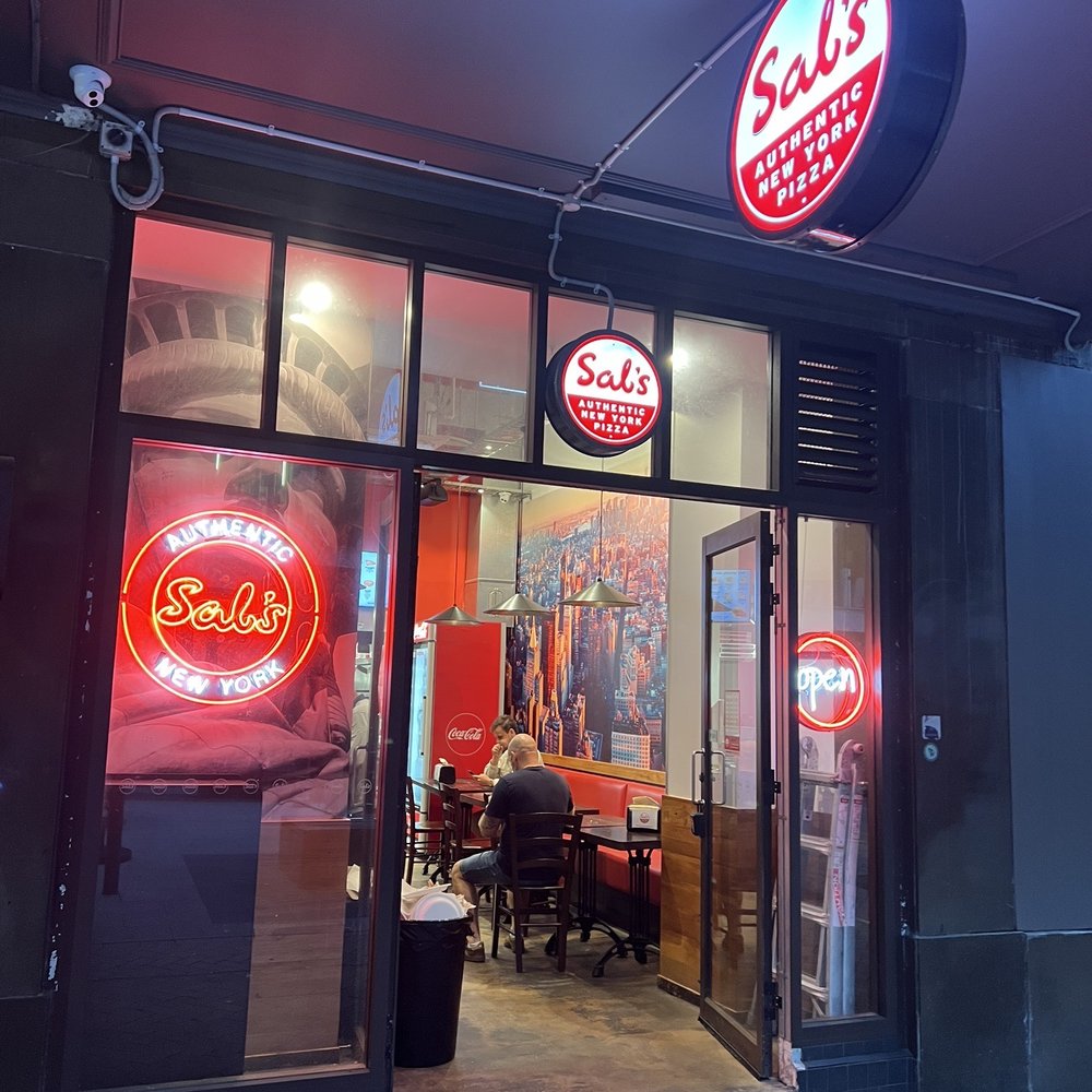 Sal’s - Storefront on a Sunday evening. - Pizza Near Me - Wellington, WGN