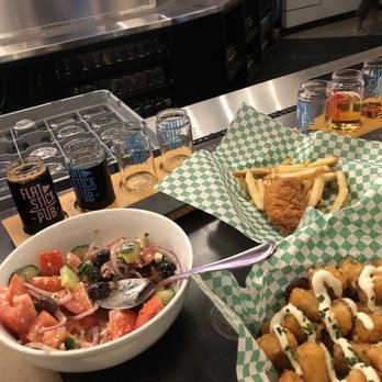 Flatstick Pub - Spokane - Greek salad, loaded tots, chicken strips and microbrew taster. No pizza pic- We ate it! - Beer Bar Near Me - Spokane, Washington Flatstick Pub - Spokane - Greek salad, loaded tots, chicken strips and microbrew taster. No pizza pic- We ate it! - Beer Bar Near Me - Spokane, Washington