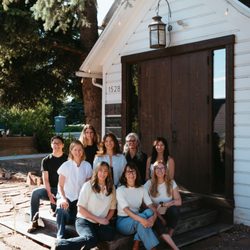 SHÈN - Our team of practitioners in front of the historic white chapel