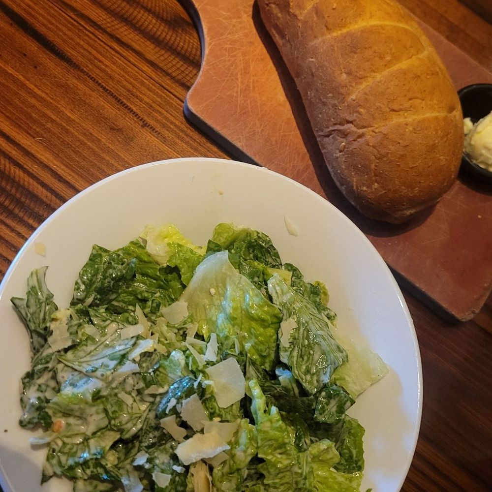 Ceasar salad and fresh bread Ceasar salad and fresh bread