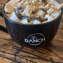 S'more's Ghirardelli Hot Chocolate; toasted marshmallow flavoring, toasted marshmallows, chocolate syrup, graham cracker crumbs S'more's Ghirardelli Hot Chocolate; toasted marshmallow flavoring, toasted marshmallows, chocolate syrup, graham cracker crumbs