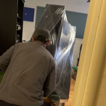 Faithful Moving - Two unassuming guys lifting the piano onto its side - Movers Near Me - San Jose, California