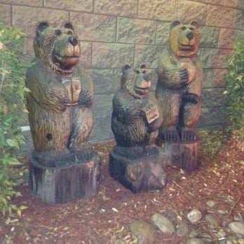 McDonald's - three carved bears in front of a brick wall - Fast Food Near Me - Oakhurst, California