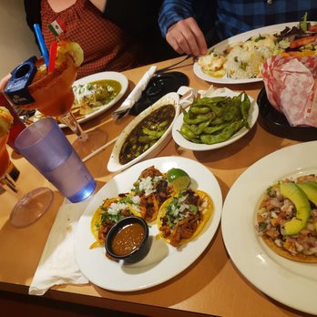 Sushingon - Our huge table of food. Top left : wet chicken burrito with green sauce. Top right : à salmon and shrimp tradition dish - Mexican Near Me - Riverside, California