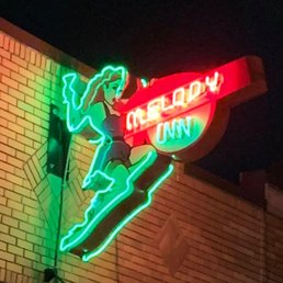 Neon sign outside the Melody Inn.