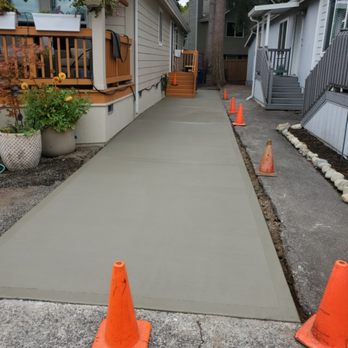 Rey Concrete - Walkway on the side of trailer home for easy garbage bin mobility. - Masonry/Concrete Near Me Rey Concrete - Walkway on the side of trailer home for easy garbage bin mobility. - Masonry/Concrete Near Me