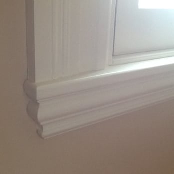 Custom Carpentry - Re-built window sill and frame.  Assembled from stock moulding parts to replicate original. - General Contractors Near Me