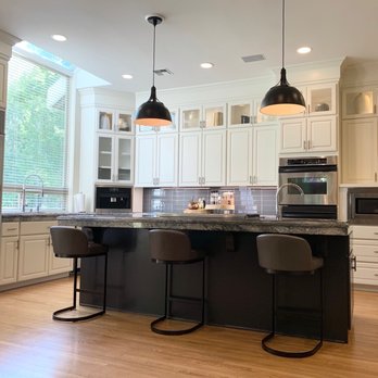 K|C Paint & Design - a kitchen with a center island - General Contractors Near Me K|C Paint & Design - a kitchen with a center island - General Contractors Near Me