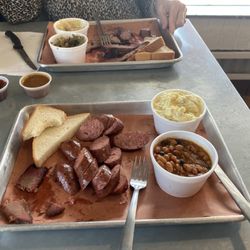 O!NK - Brisket and sausage, along with baked beans, potato salad, green beans and boiled cabbage