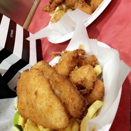 two plates of fried fish and fries two plates of fried fish and fries