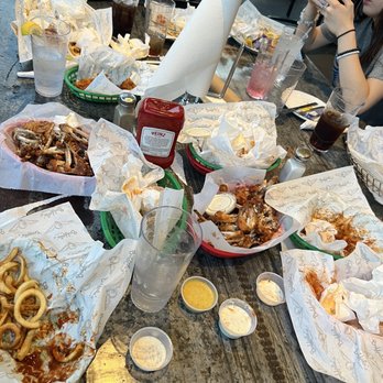 Buffalo's - a table full of food and drinks - Chicken Wings Near Me - Dacula, Georgia