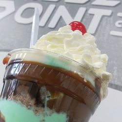 Freezing Point Ice Cream - 2-scoop sundae: pistachio & coconut rum, chocolate caramel syrup, whipped cream & a cherry