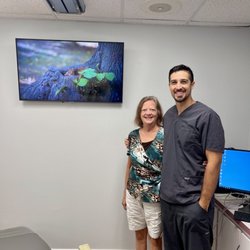 Modern Day Smiles Dentistry - Dr. Spinuso with his patient. Happy healthy smiles!