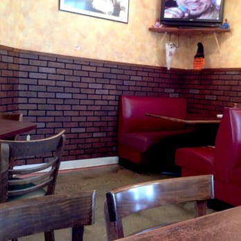 La Cabana - Interior features booths and tables, and a TV.  Comfy and cool on a hot day. - Mexican Near Me - Richmond, Virginia