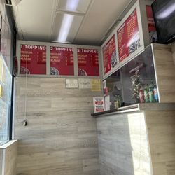 Roman's Pizza - Front with current prices