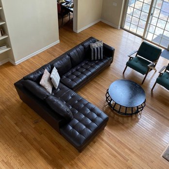 Clearview Treatment Programs - Open living room with leather sectional, shelves, and natural light at Clearview's gender-inclusive mental health program. - Counseling & Mental Health Near Me - Los Angeles, California