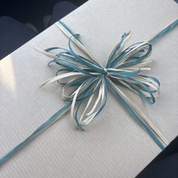 Gift wrapped with a bow made by Ivy :)