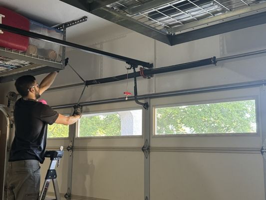 Complete Garage Door Rebuild - Installed new torsion springs, rollers, lift cables, and drums, then performed a full tune-up and safety inspection to restore proper balance and reliable operation.