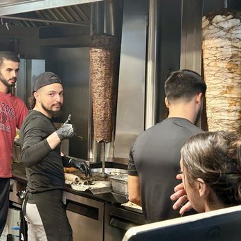 Syrian Shawarma - Workers shaving off the shawarma - Fast Food Near Me - Temple Terrace, Florida