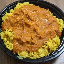 Plates & Bowls - Butter chicken bowl on rice. It's BOGO on Uber Eats.
