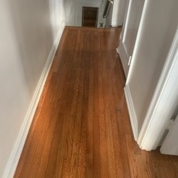 a hardwood floor in a hallway a hardwood floor in a hallway