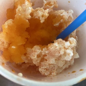 SnOGo - a bowl of food with a spoon in it - Shaved Ice Near Me