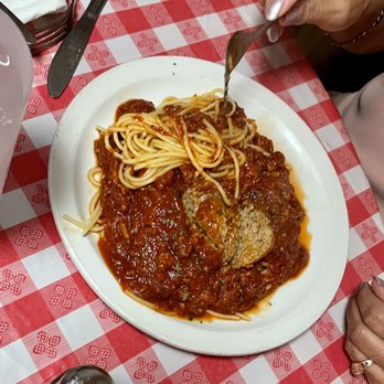 The Italian Kitchen - Large Meatball with spaghetti. - Salad Near Me - El Paso, Texas The Italian Kitchen - Large Meatball with spaghetti. - Salad Near Me - El Paso, Texas