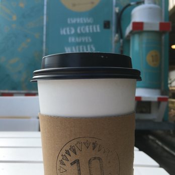 Tenco Coffee - a cup of coffee on a table - Food Trucks Near Me Tenco Coffee - a cup of coffee on a table - Food Trucks Near Me