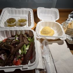 Mikonos Restaurant - Horitaki Salad, Gyro meat and a side of Hummus. All very good.