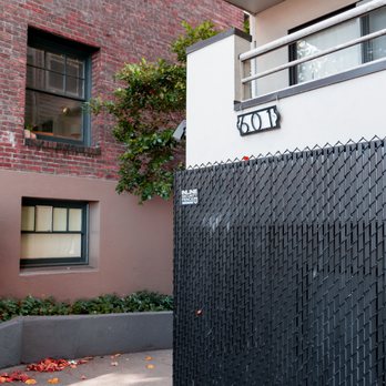 Inline Security Fence - Black chain-link fence with black privacy slats. The privacy slats are designed to create a visual barrier. - Fences & Gates Near Me - Kent, Washington
