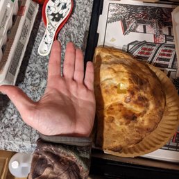 13 dollar calzone not much bigger than my hand. 13 dollar calzone not much bigger than my hand.
