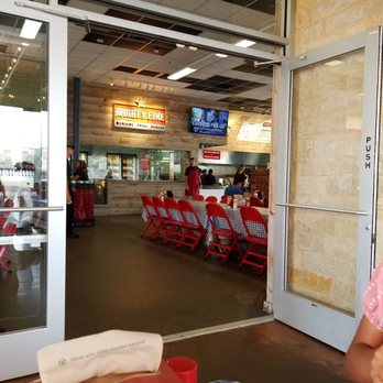 Mighty Fine Burgers University Oaks - The kitchen and food pickup area - Burgers Near Me - Round Rock, Texas