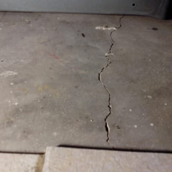 Creative Concepts Realty - Cracked foundation under stove - loose kitchen tiles nearby. - Real Estate Agents Near Me - Yuma, Arizona