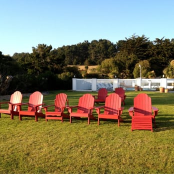 Castle Inn - You can sit on one of these red chairs and get a nice view of the ocean. - Hotels Near Me - Cambria, California Castle Inn - You can sit on one of these red chairs and get a nice view of the ocean. - Hotels Near Me - Cambria, California